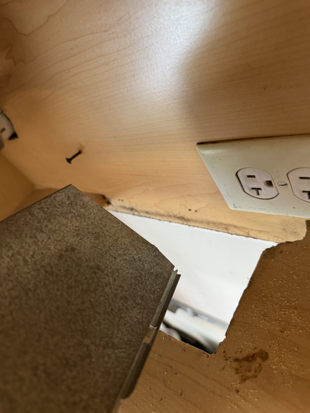 Cabinet floor cut for a microwave vent